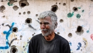 An elderly Palestinian man reactsas he stands in front of a building hit by an Israeli strike, in Gaza City's eastern neighbourhood of Shujaiya on April 10, 2025. Photo by Omar AL-QATTAA / AFP