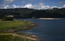 A view of the San Rafael Reservoir, a dam that is part of the Chingaza system, which supplies 70% of the water used in Bogotá, in the municipality of La Calera, Cundinamarca department, Colombia, on April 3, 2025. Photo by Raul ARBOLEDA / AFP.