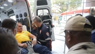 Former Brazilian president Jair Bolsonaro arrives by ambulance at the Rio Grande Hospital in Natal, Rio Grande do Norte state, Brazil on April 11, 2025. (Photo by MAGNUS NASCIMENTO / AFP)
