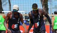 Qatar's Ahmed Tijan (left) Cherif Younousse celebrate a point.