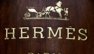 The Hermes store name is pictured above the facade of a shop, on December 26, 2012 in Paris. AFP PHOTO / JOEL SAGET