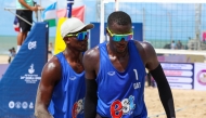 Qatar’s Cherif Younousse (right) and Ahmed Tijan celebrate a point against Australia’s Paul Burnett and Luke Ryan.