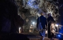 Wits University students walk up a flight of stairs at the Sterkfontein caves located within the Cradle of Humankind UNESCO World Heritage Site in Krugersdorp near Johannesburg on April 15, 2025. (Photo by Emmanuel Croset / AFP)