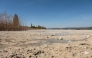 The lakeshore is seen on Reichenau Island in Lake Constance (Bodensee), southern Germany, where the water level of the lake is at its lowest level in spring for decades, on April 12, 2025. (Photo by Silas Stein / AFP)