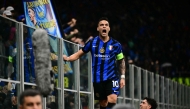 Inter Milan's Argentine forward #10 Lautaro Martinez celebrates scoring his team's first goal during the UEFA Champions League quarter final second leg football match between Inter Milan and Bayern Munich at the San Siro stadium in Milan on April 16, 2025. (Photo by Marco BERTORELLO / AFP)
