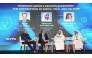 Officials attending a panel discussion.