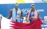 Cherif Younousse (left) and Ahmed Tijan celebrate with the Qatari flag after sealing the title.  