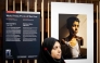 World Press Photo of 2025 award winner Samar Abu Elouf poses next to her winning photograph depicting a nine-year-old Palestinian boy who lost both arms during an Israeli attack on Gaza City at the Nieuwe Kerk in Amsterdam on April 17, 2025. (Photo by Robin van Lonkhuijsen / ANP / AFP) 