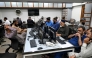 Stockbrokers monitor share prices on computers during a trading session at the Pakistan Stock Exchange (PSX) in Karachi on April 9, 2025. (Photo by Rizwan Tabassum / AFP)

