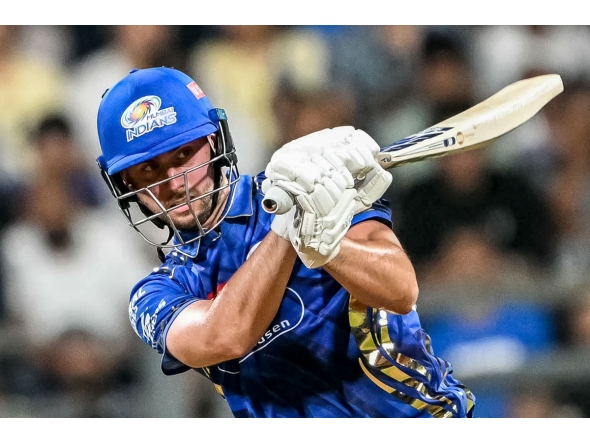 Mumbai Indians' Will Jacks watches the ball after playing a shot during the Indian Premier League (IPL) Twenty20 cricket match between Mumbai Indians and Sunrisers Hyderabad at the Wankhede Stadium in Mumbai on April 17, 2025. (Photo by Punit PARANJPE / AFP)