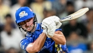 Mumbai Indians' Will Jacks watches the ball after playing a shot during the Indian Premier League (IPL) Twenty20 cricket match between Mumbai Indians and Sunrisers Hyderabad at the Wankhede Stadium in Mumbai on April 17, 2025. (Photo by Punit PARANJPE / AFP)