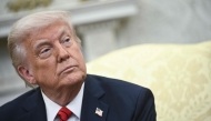 US President Donald Trump listens as he meets with Italian Prime Minister Giorgia Meloni in the Oval Office of the White House in Washington, DC, on April 17, 2025. (Photo by Brendan SMIALOWSKI / AFP)
