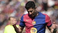 Barcelona's Polish forward #09 Robert Lewandowski reacts during the Spanish league football match between FC Barcelona and RC Celta de Vigo at the Estadi Olimpic Lluis Companys in Barcelona on April 19, 2025. (Photo by Josep LAGO / AFP)