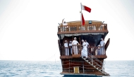 Participants aboard a traditional dhow boat during the hand-line fishing competition of the Senyar Festival off of Sealine south of Doha on April 21, 2025. (Photo by Karim Jaafar / AFP)