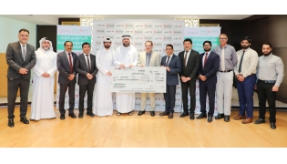 LuLu Hypermarket Qatar officials handing over the donation cheque.