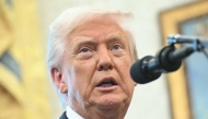 US President Donald Trump speaks to reporters as he participates in the swearing-in ceremony for Paul Atkins, Chairman of the Securities and Exchange Commission (SEC), in the Oval Office of the White House on Washington, DC, April 22, 2025. (Photo by Saul Loeb / AFP)
 