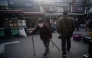 An elderly woman walks in the Dongmyo Flea Market in Seoul on April 15, 2025. (Photo by ANTHONY WALLACE / AFP)
