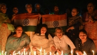 Mourners light candles in Amritsar on April 23, 2025, as they pay tribute to tourists who were shot dead by terrorists in Kashmir's Pahalgam. (Photo by Narinder Nanu / AFP)
