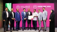 Zambia’s Minister of Education, Douglas Syakalima, with other officials as he officially unveils Malabar Group’s Hunger-Free World initiative in Zambia. 