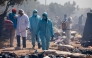 Members of Tunisian security forces dispense disinfectants as they dismantle a makeshift camp for migrants from sub-Saharan Africa at Ben Farhat farm near the Tunisian city of Sfax on April 24, 2025. (Photo by Mohamed KHALIL / AFP)
