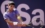 Spain's Carlos Alcaraz returns the ball to France's Arthur Fils during the ATP Barcelona Open 