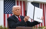 (FILES) US President Donald Trump holds a signed executive order after delivering remarks on reciprocal tariffs during an event in the Rose Garden entitled 