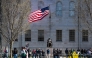 Demonstrators stand around the John Harvard Statue in Harvard Yard following a rally against President Donald Trump痴 attacks on Harvard University at Harvard University in Cambridge, Massachusetts on April 17, 2025. (Photo by Joseph Prezioso / AFP)