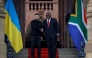 Ukraine's President Volodymyr Zelensky (left) is greeted by South Africa's President Cyril Ramaphosa during an official visit to South Africa, at the Union Buildings in Pretoria on April 24, 2024. (Photo by Phill Magakoe / AFP)