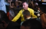 (FILES) Former Brazilian President Jair Bolsonaro is pictured before boarding an ambulance as he leaves Rio Grande Hospital in Natal, Rio Grande do Norte state, Brazil, on April 12, 2025. (Photo by Jose ALDENIR / AFP)
