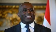 Britain's Foreign Secretary David Lammy poses for photos upon his arrival at the Quai d'Orsay, France's Minister of Foreign Affairs before a bilateral meeting in Paris on April 17, 2025. (Photo by Julien De Rosa / Pool / AFP)
