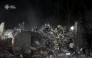 This handout photograph taken and released by the State Emergency Service of Ukraine on April 24, 2025, shows Ukrainian rescuers operating at the site of a Russian missile attack in Kyiv, amid the Russian invasion of Ukraine. Photo by Handout / State Emergency Service of Ukraine / AFP.