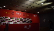The empty press conference tribune is seen as Real Madrid decides not to attend a press conference at La Cartuja stadium on the eve of their Spanish Cup (King's Cup) final between FC Barcelona and Real Madrid CF in Seville, on April 25, 2025. (Photo by CRISTINA QUICLER / AFP)
