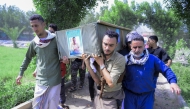 Yemenis attend the funeral of people killed in reported US strikes a day earlier on the port of Ras Issa area in Yemen's Huthi-held Hodeida on April 21, 2025. (Photo by AFP)