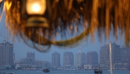 Boats sail in Doha's West Bay waters on April 25, 2025. (Photo by Karim Jaafar / AFP)