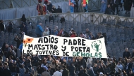 Attendees hold a banner reading 