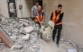 Palestinian medics transport the body of a victim following Israeli strikes which hit apartments in a residential building in Gaza City's Yarmuk street on April 24, 2025. Photo by Omar Al-Qattaa / AFP
