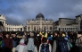 Attendees and nuns stand in front of St Peter's Basilica as they wait for late Pope Francis' funeral ceremony at St Peter's Square in The Vatican on April 26, 2025. (Photo by JEFF PACHOUD / AFP)