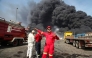 Thick, black smoke rises as rescuers arrive near the source of an explosion at the Shahid Rajaee port dock southwest of Bandar Abbas in the Iranian province of Hormozgan on April 26, 2025. (Photo by MOHAMMAD RASOLE MORADI / IRNA / AFP)
