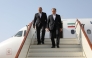 This handout picture provided by the Iranian Foreign Ministry shows Iran's Foreign Minister Abbas Araghchi (R) descending the stairs of his plane upon his arrival in Muscat on April 25, 2025. (Photo by Iranian Foreign Ministry / AFP)