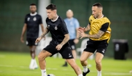Al Sadd's Cristo Gonzalez (left) and Guilherme Torres during a training session yesterday.