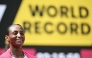 Ethiopia's Tigst Assefa smiles after crossing the line to win the women's race at the 2025 London Marathon in central London on April 27, 2025. (Photo by Justin Tallis / AFP) / 