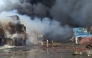 Firefighters and rescuers work at the scene of an explosion that took place a day earlier at the Shahid Rajaee port dock, southwest of Bandar Abbas in the Iranian province of Hormozgan, on April 27, 2025.  (Photo by Meysam Mirsadeh / Tasnim News / AFP)