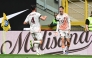 Roma's Argentinian forward #18 Matias Soule (R) celebrates with a teammate after scoring his team first goal during the Italian Serie A football match between Inter Milan and Roma at the San Siro stadium in Milan on April 27, 2025. (Photo by Piero CRUCIATTI / AFP)