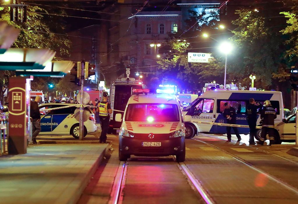 Hungarian police officials investigate in Budapest downtown as an explosion of unknown origin rocked in a building late night on September 24, 2016 injuring two passing police officers. The explosion, which was heard across large parts of the Hungarian ca