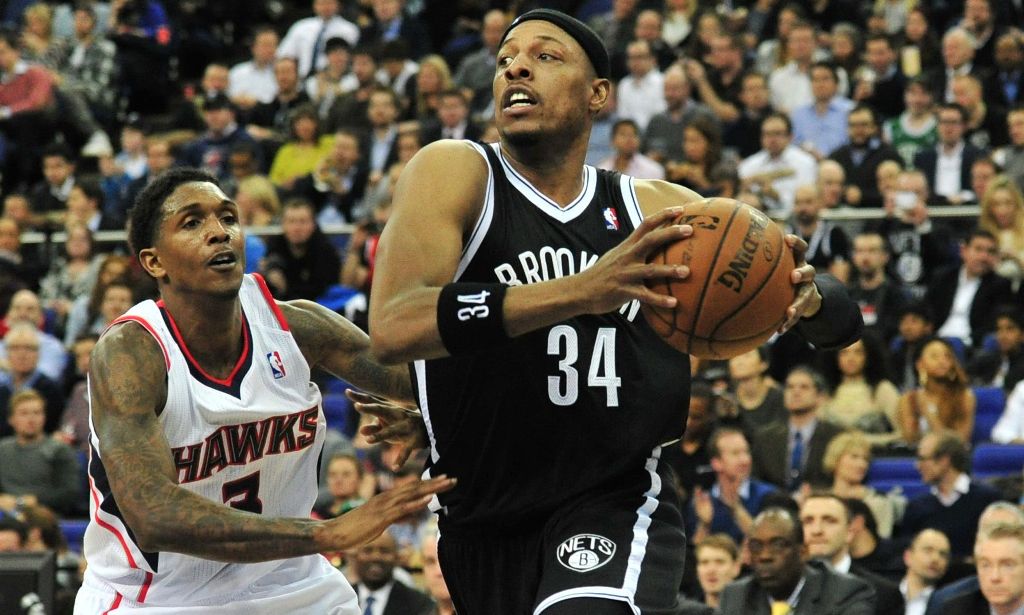 This file photo taken on January 16, 2014 shows Brooklyn Nets' player Paul Pierce (R) dribbling past the Atlanta Hawks' Louis Williams (L) during the NBA Global Games London 2014 basketball match between Atlanta Hawks and Brooklyn Nets at the O2 Arena in 