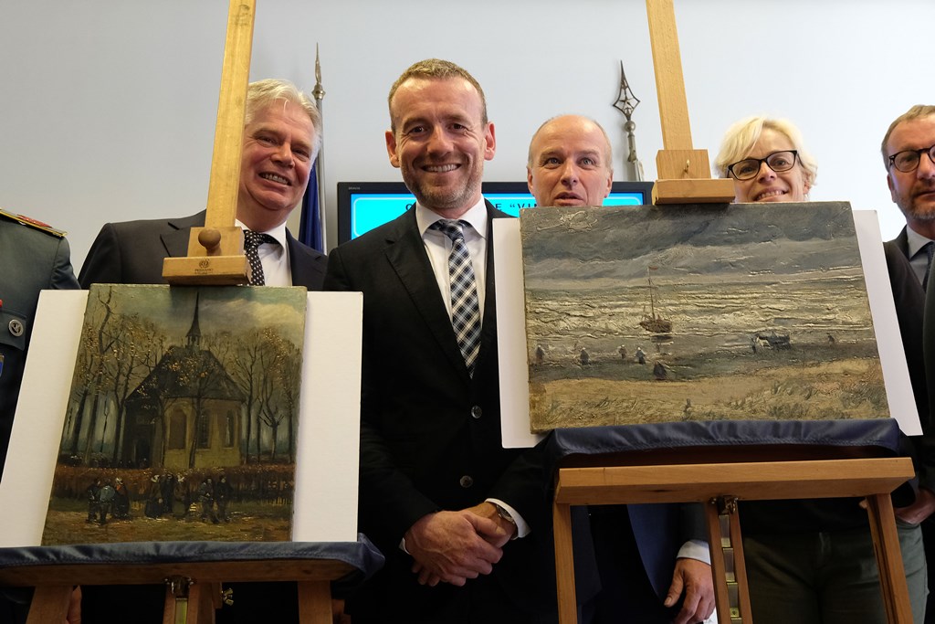 Axel Ruger (C), Director of the Van Gogh museum poses next to two recently recovered stolen paintings by late Dutch artist Vincent Van Gogh entitled 