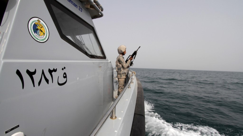 A Saudi border guard watches as he stands in a boat off the coast of the Red Sea on Saudi Arabia's maritime border with Yemen, near Jizan. (Reuters/File photo)