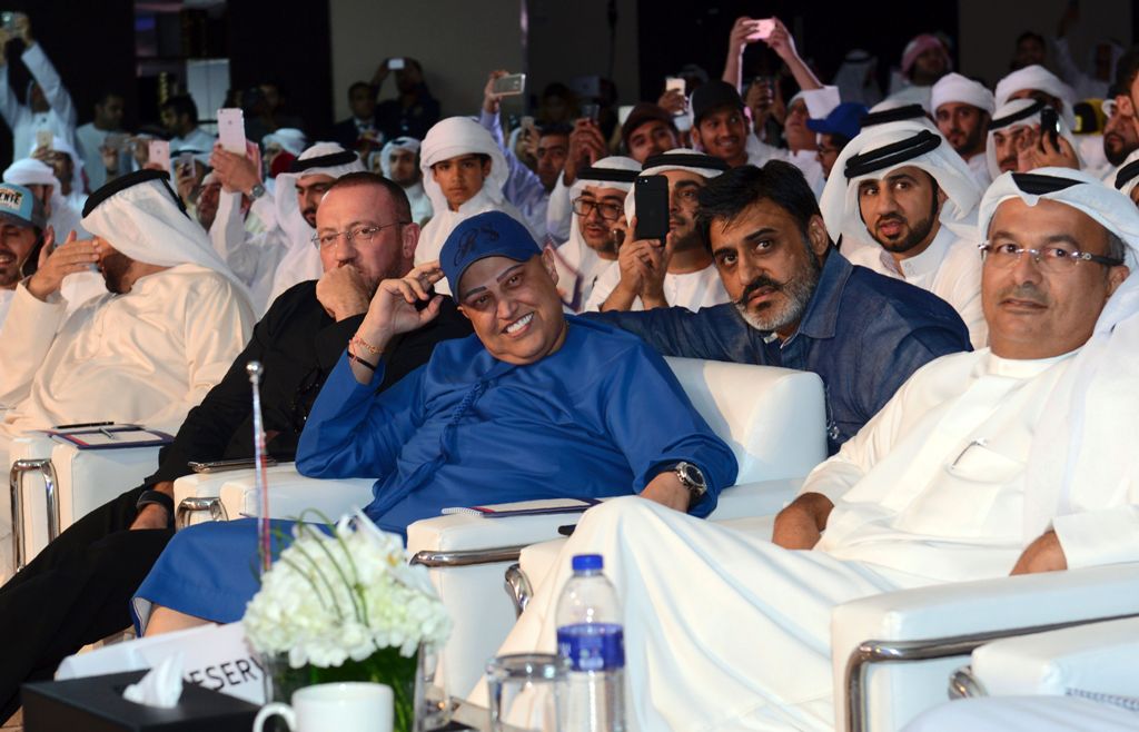 Dubai-based Indian businessman Balwinder Sahani (C) looks on during an auction in Dubai on October 8, 2016. Sahani, an owner of an international real estate company, paid 33 million dirhams ($9 million) for a Dubai license plate bearing the number 5. / AF