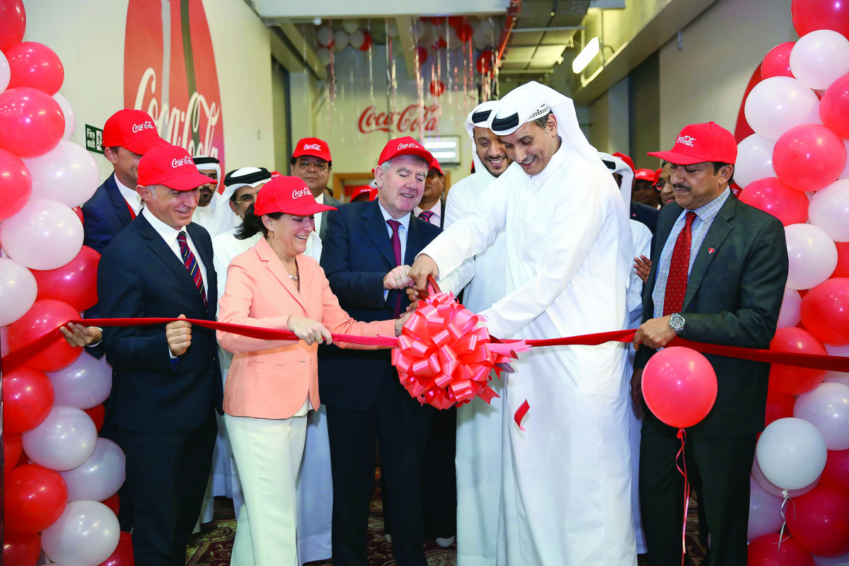 Dana Shell Smith (second left), US Ambassador to Qatar, Irial Finan (third left), Executive Vice President of The Coca-Cola Company and President of the Bottling Investments Group, Saud O Al Mana (second right), Vice Chairman of Al Mana Group, Murat Ozgel