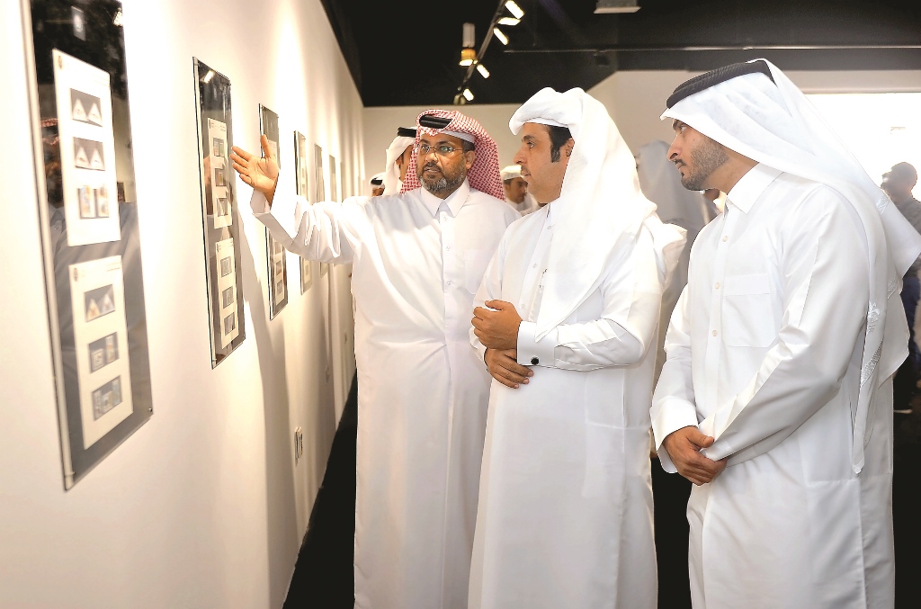 Khalid Rustom (left) Head of Arab Postal Stamps Museum, Katara, gives a briefing about stamps to Abdullah Shlash Al Hajri (centre), CEO, Human Resources and Services, Q-Post, and Waleed Abd Alhadi Alyafei (right) Head of Public Relations, Ministry of Muni